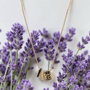 Coach Gold-Tone Pendant Necklace with Black Enamel and Crystal Accents